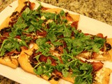 143.0...Ricotta and Caramelized Onion Flatbread Topped with Prosciutto and Arugula