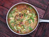 Bok choy and black beans simmered in tomato coconut sauce