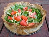 Goat cheese & caramelized onion tart with arugula & pine nuts