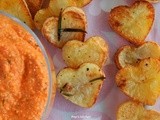 Red pepper dip with feta cheese and heart shaped potatoes
