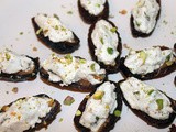 Dates stuffed with cardamom goat cheese and salted pistachios