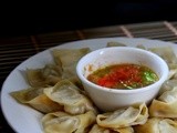Momo – Nepali style steamed dumplings with hot tomato chili sauce
