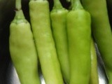 Chilli  Bajji, ( Long green chillis dipped in a thick spicy gramflour batter and deep fried.)