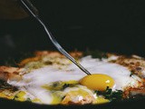 Breakfast naan skillet pizza with mustard greens and paneer