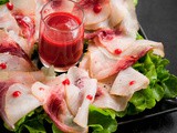 Carpaccio di pesce spada con salsa agra di lamponi