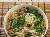 Rice noodle bowl with sausage and greens
