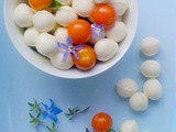  French  Caprese Salad? Cherry tomatoes, bocconcini and blue borage flowers
