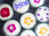 Vegan chocolate and coconut cream puddings with edible flowers