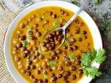 Gujarati Rasawala chana (Black chickpeas simmered in a gram flour curry)