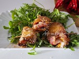 Rotolini di peperoni gratinati con crudo e provola