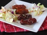 Baked chicken wings and a spiced, sweet and sour sauce