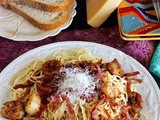 Spicy spaghetti with seared scallops and salami