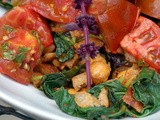 Warmed Tomatoes and Basil over Garlicky Greens