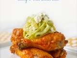 Baked buffalo wings with celery and blue cheese slaw