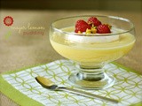 Meyer lemon pudding with chantilly cream, raspberries, and pistachios