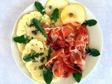 Carpaccio di cavolfiore con fiocco di prosciutto e tarassaco