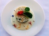 Risotto con piselli ,erbe e fiori di campo con fonduta all'Asiago