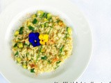 Risotto con zucchine in fiore e bottarga