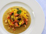 Tagliatelle con crema di fave , trota salmonata e mandorle croccanti