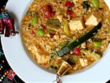 Asian influenced savoury breakfast porridge-broth with tofu, sundried tomatoes, edamame beans