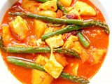 Asparagus, Halloumi & potato curry in roasted garlic, chilli and pomegranate