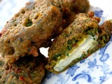 Christmas starters and sides-Goats cheese pakora in a spinach, sundried tomato, fennel, cumin and gram flour batter