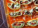 Slow roasted tomato and pistachio pasta rotolo in a spiced butternut squash sauce