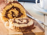 Nutella Roulade (swiss roll cake) with toasted hazelnuts