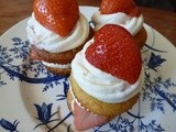 Stacked Vanilla Cupcakes with Vodka infused Strawberries, Vanilla Bourbon Chantilly Cream and Cream Cheese and Elderflower Frosting with diced Strawberries