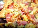 Fully Loaded: Celebrate National Pineapple Pizza Day with the Greenwich Hawaiian Overload Pizza