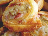 Cheesy puff pastry rolls with proscuitto & olives