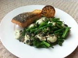 Greens with spicy avocado sauce, seeds and salmon