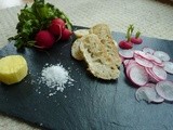 Radishes, salt, butter, bread and a tasting platter