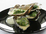 Gegratineerde oesters met spinazie en botersaus