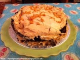 Coconut and lime chocolate brownie meringue cake topped with honeycomb