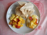 Meringue with strawberries and mango