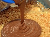 Caramel peanut butter krispy bars topped with a thick, chocolate glaze