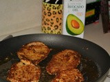 Chicken pan fried in avocado oil topped with pesto and served over a salad with strawberries