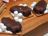Chocolate dipped graham crackers stuffed with marshmallow & reese's peanut butter cup trees