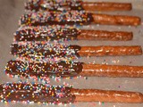 Chocolate dipped pretzel rods-because sprinkles make you smile