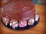 Chocolate layer cake decorated with chocolate dipped oreos