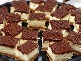 Dulce de leche cheesecake bars served with a mason jar filled with homemade salted caramel