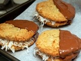 Dulce de leche stuffed coconut cookies dipped in milk chocolate