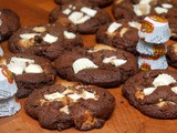 Reese's white peanut butter cups baked into thick, chocolate cookies