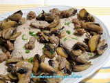 Fette di arista con funghi champignon