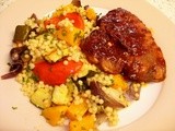 Mediterranean style giant couscous with barbecue pork chops