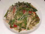 Stir fry enoki mushrooms with snow peas