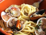 Pici all'arancia con frutti di mare