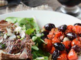 Beef tagliata with olives and tomatoes