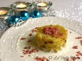 Tortino di patate in tecia alla triestina su fonduta di Bonquartì Mauri e briciole di salsiccia